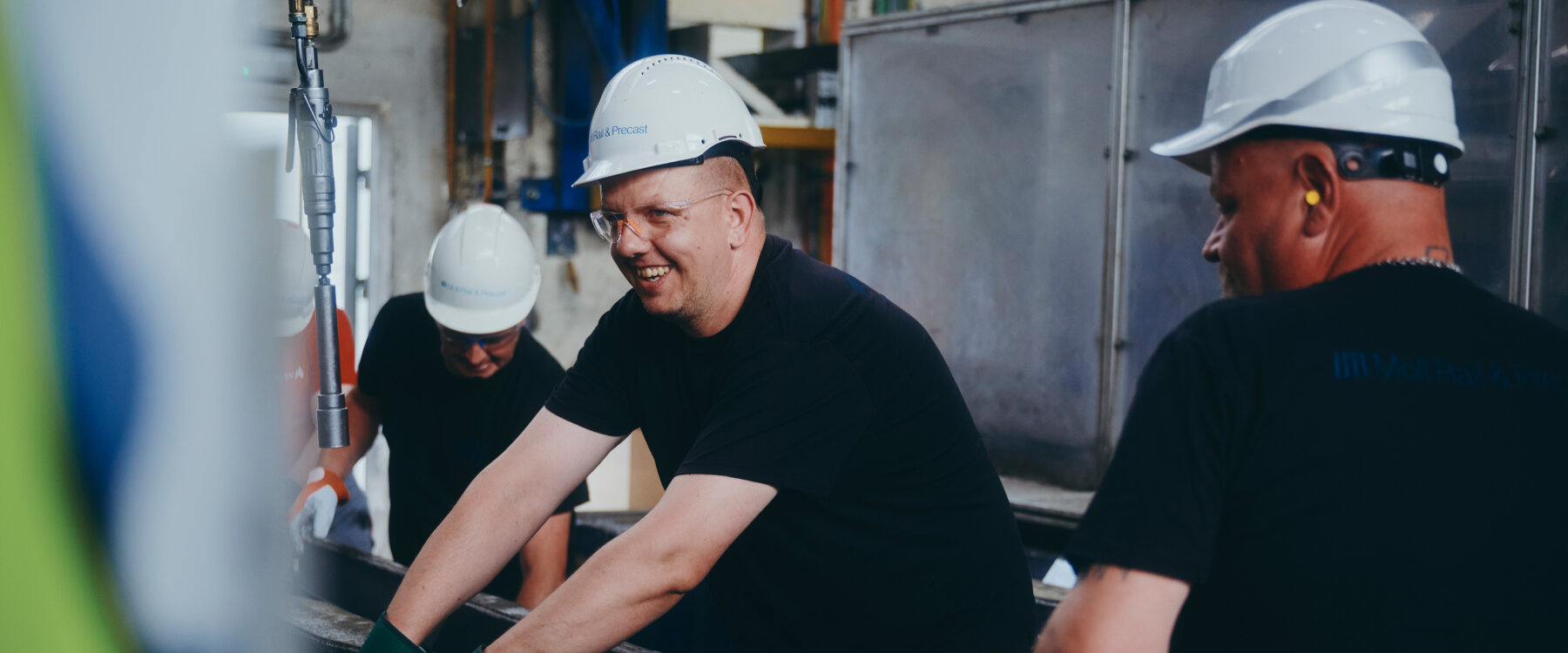 Employees smiling while working © Max Freiburger Employees smiling while working © Max Freiburger